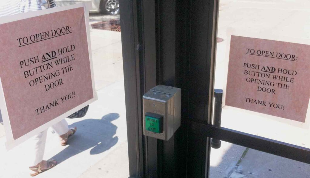 two signs next to button